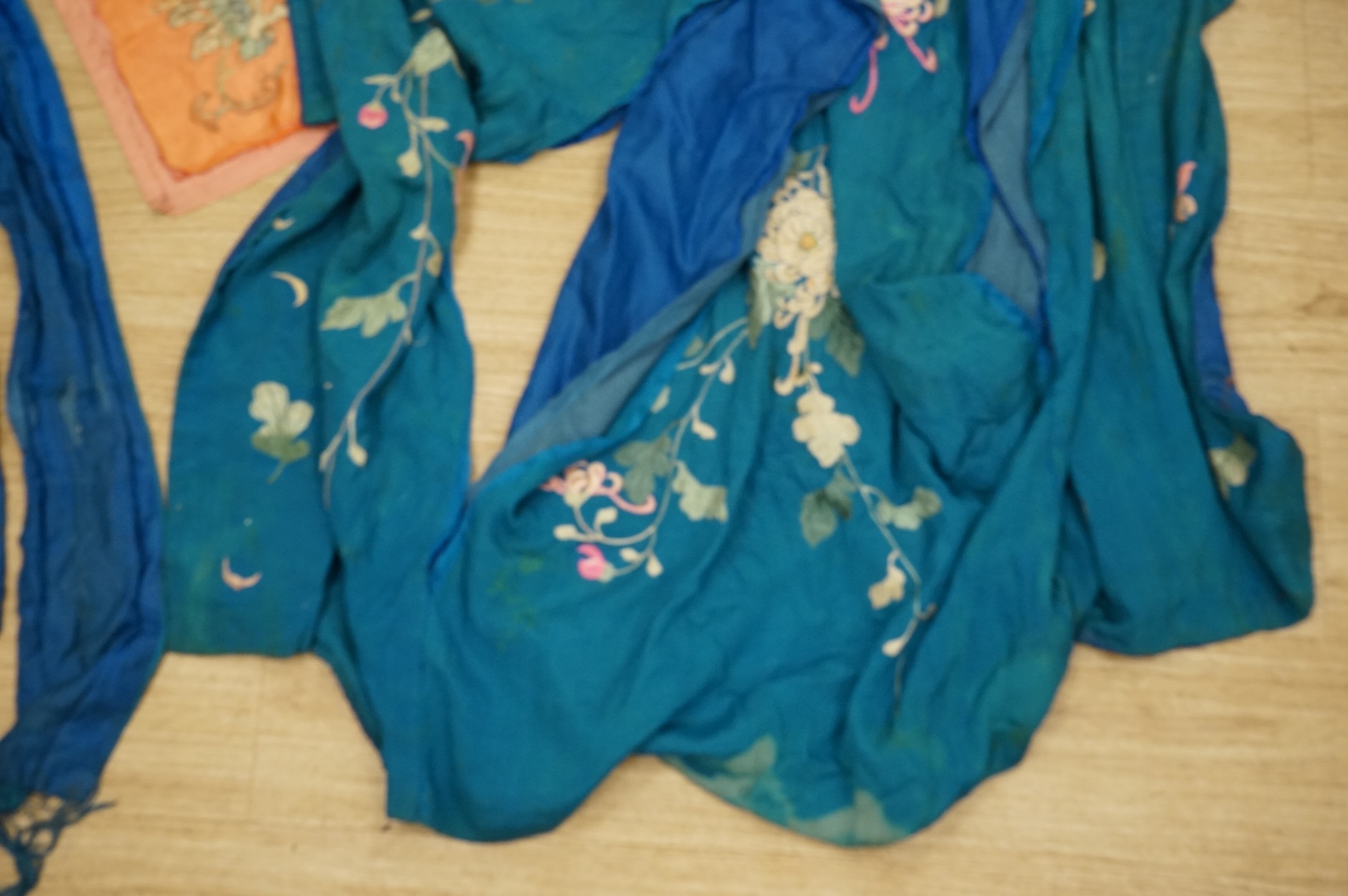 A collection of Chinese and Japanese embroidered kimonos and textiles